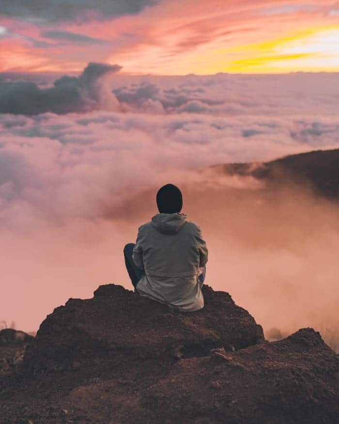 man doing meditation in nature
